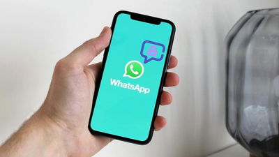 Man holding a phone with WhatsApp icon in middle