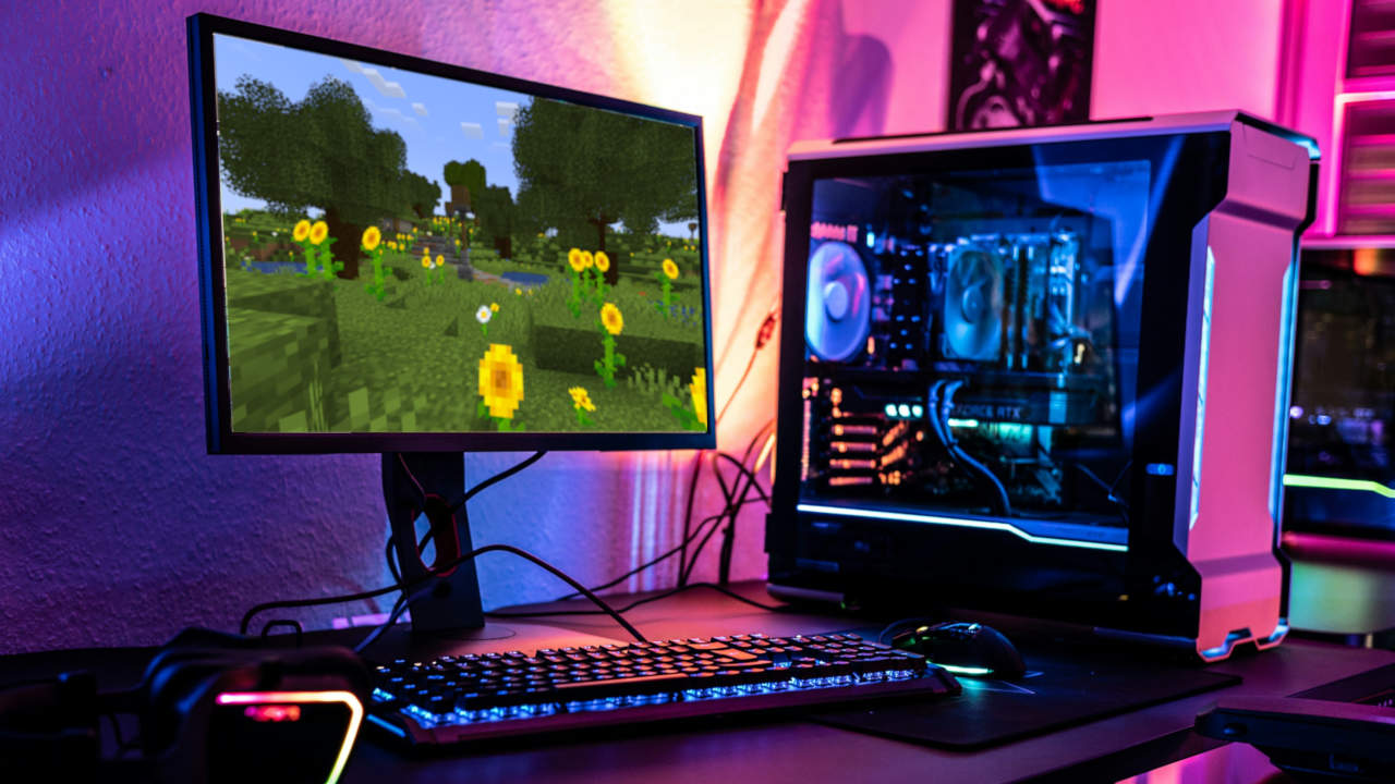 A photograph showing a gaming PC running in a dimly lit room.