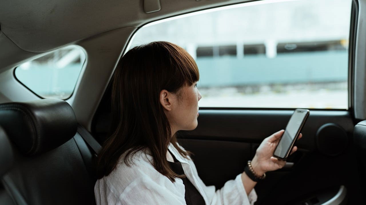Calm Woman Using Phone In Car Pexels Ketut Subiyanto