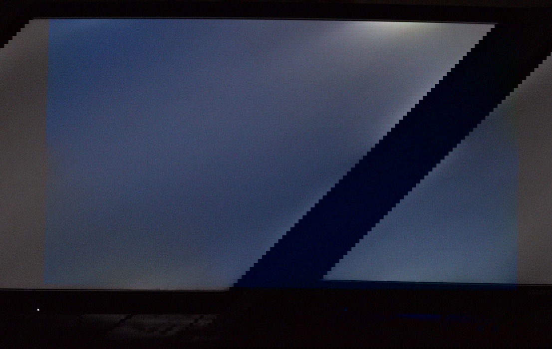 Large screen TV showing backlight bleeding effect in dark room