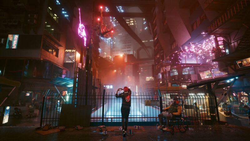 An image from the game Cyberpunk 2077, showcasing a richly-lit futuristic city at night.