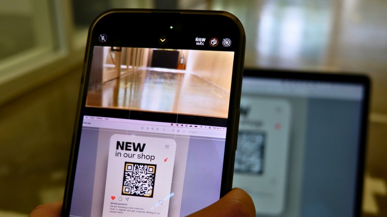 Featured image courtesy Unsplash depicting scanning QR code on a Windows laptop.