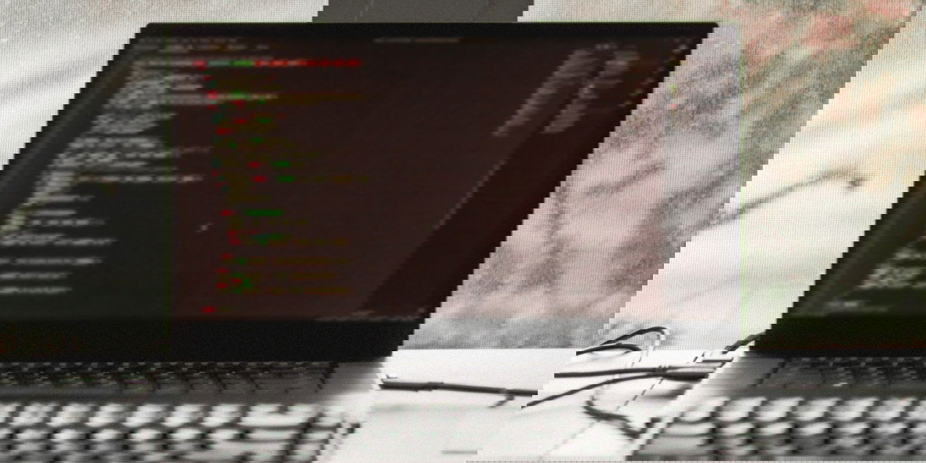 A photograph of a laptop running a terminal emulator.