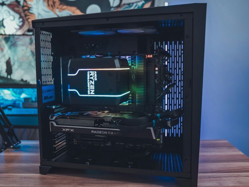 A black gaming PC with an AMD Ryzen CPU cooler and AMD graphics card