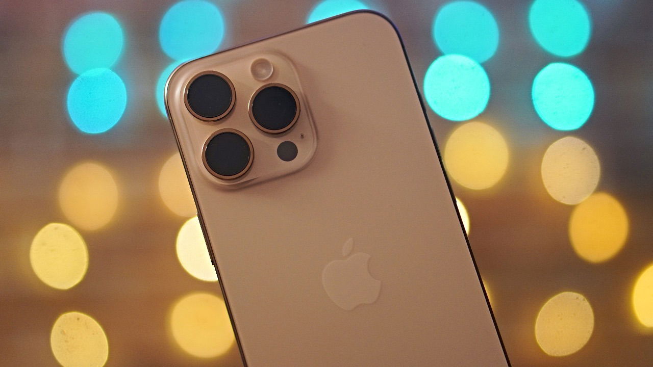 iPhone 16 Pro Max with a colorful background