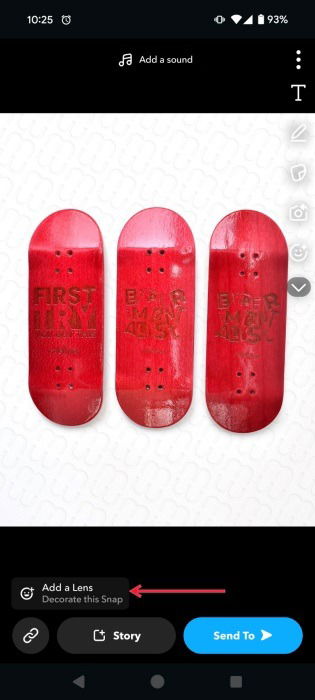 Tapping "Add a Lens" option in Snapchat snap creation screen. 