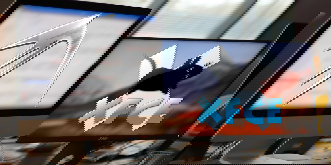 A photograph of two desktop monitors on a work table.