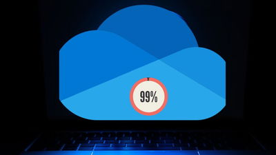 A 99% display over the OneDrive logo on a PC screen.