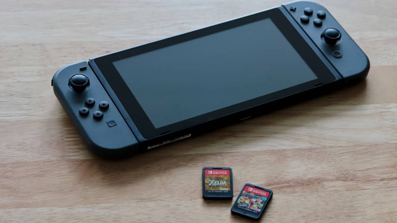 Nintendo Switch console with two games.
