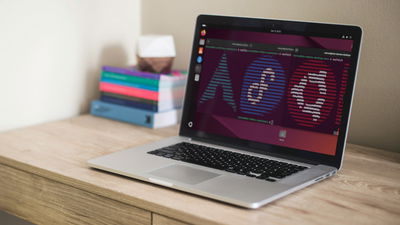 A photograph of a laptop on top of a table.