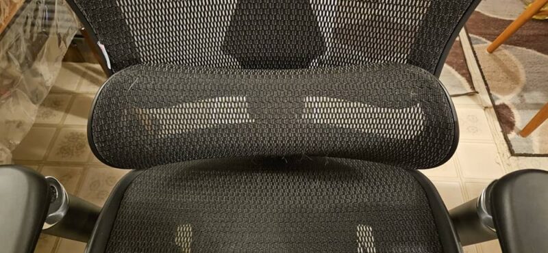 Lumbar cushion in chair.