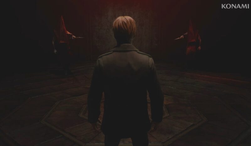 An image from the game remake of Silent Hill 2, with a man with blond hair facing two monsters. 
