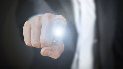 A man with energy coming out of his finger.