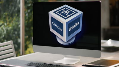 A photograph of a desktop on a gray table.