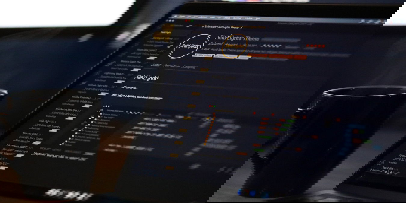 A photograph of a laptop running VSCode.