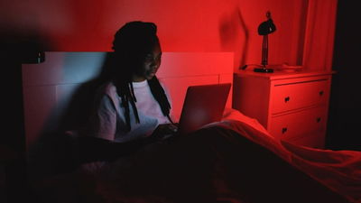 Woman reviewing information on her laptop.