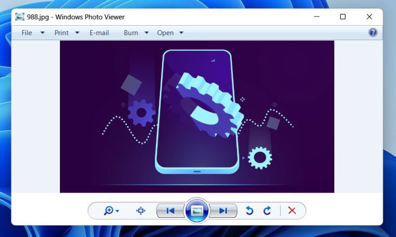 Windows Photo Viewer with an opened image showing a phone and cog
