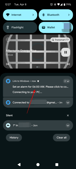 Tapping on alarm notification on Android phone after setting it using Copilot. 
