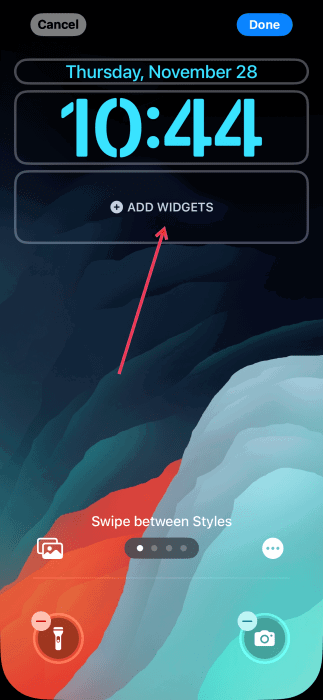 Tapping on "Add widgets" button in iPhone lock screen.