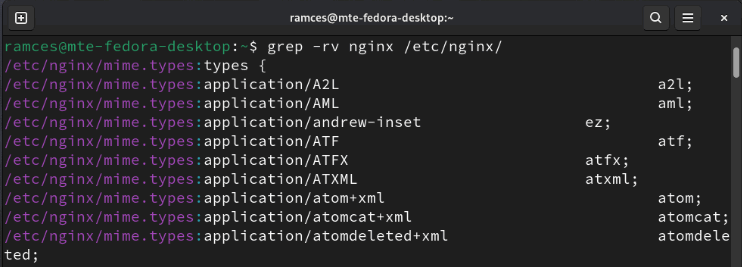A terminal showing Grep's invert flag that matches everything but the target string.